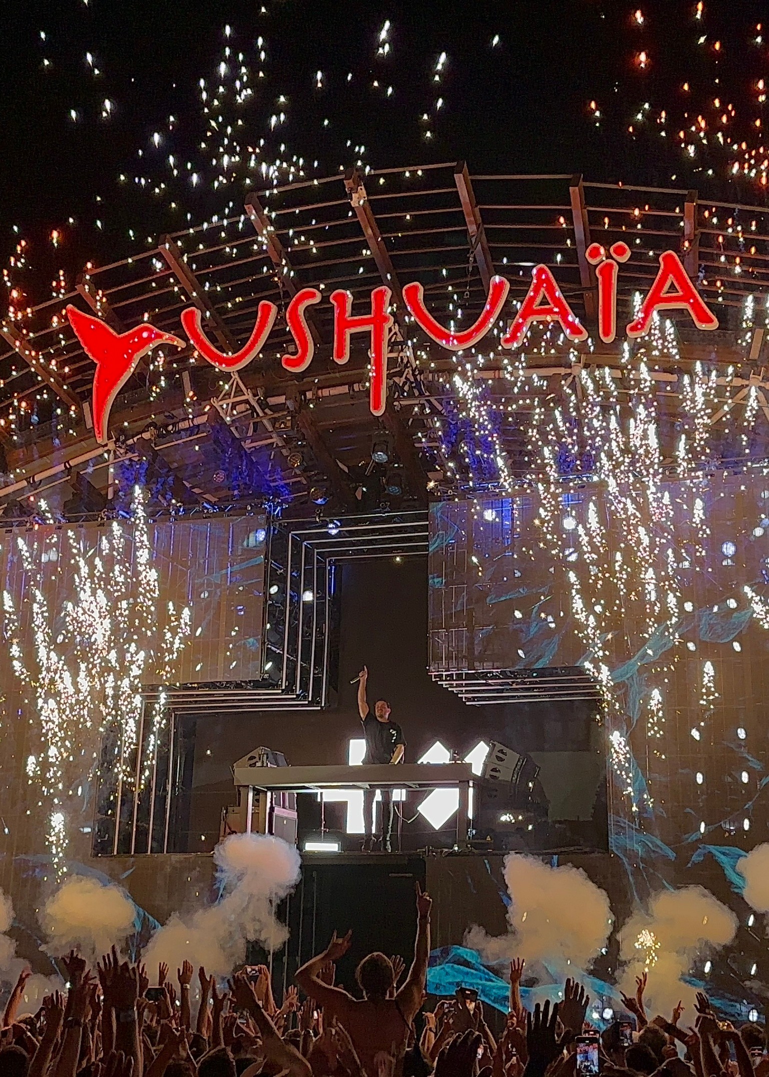 A music event at Ushuaïa in Ibiza. There are lights and fireworks.